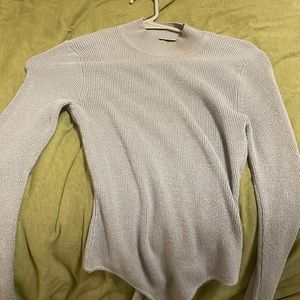 Open back. Turtle neck sweater
